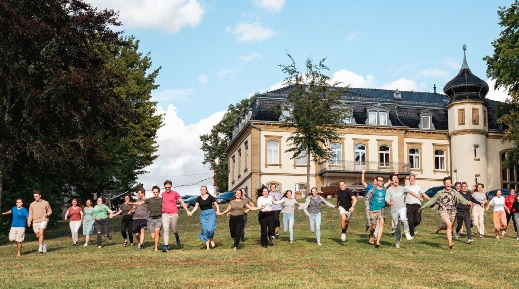 Buchenauerhof Castle, DMG headquarters, with young short-termers. Pic DMG photographer