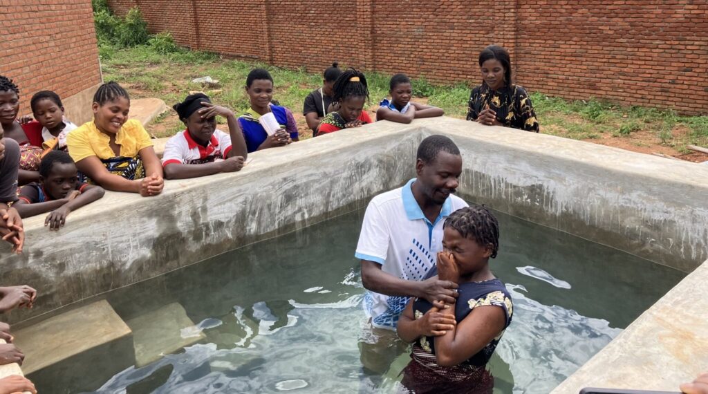 Baptism of a young woman in Malawi. Pic SIM photographer
