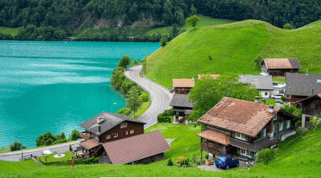 A view of Swiss mountain chalets and a lake