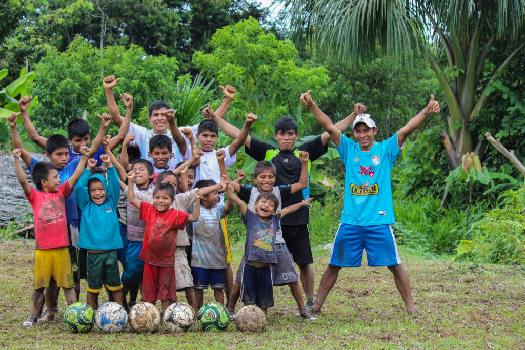 A group of children smiling in a Christian sports camp in the Amazon, Peru