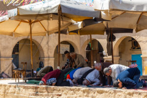 Muslim men prayin in North Africa-1
